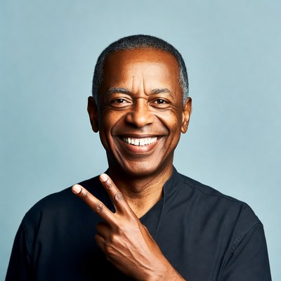 African-American man making peace sign