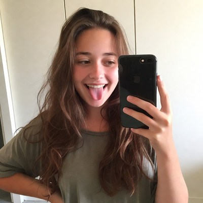 Girl sticking tongue out selfie