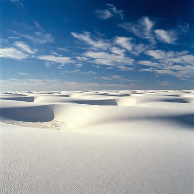 White sand dunes under blue sky