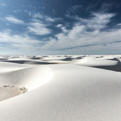 White Sand Dunes Under Blue Sky