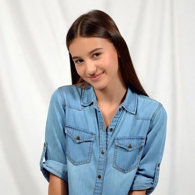 Smiling girl in denim shirt