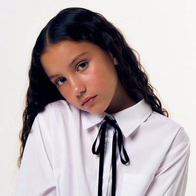 Girl in white shirt with black bowtie