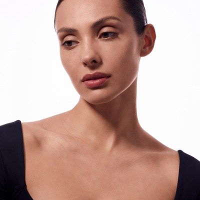 Woman with bun gazing sideways