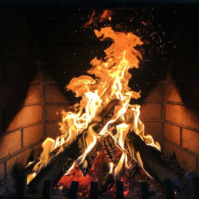 Blazing Fire in Brick Fireplace