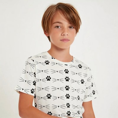 Boy wearing cat paw print t-shirt