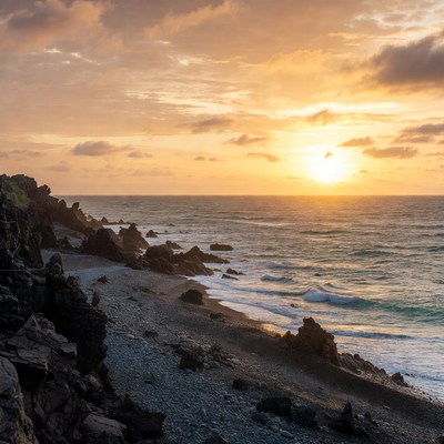 Sunset over rocky beach