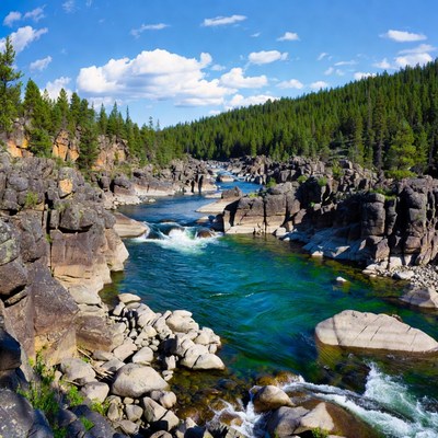 Turquoise River Flowing Through Rocky Forest Canyon