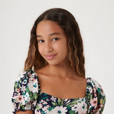 Teen girl in floral puff sleeve dress