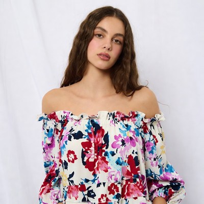 Woman in floral off-shoulder dress