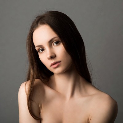 Nude woman with long brown hair