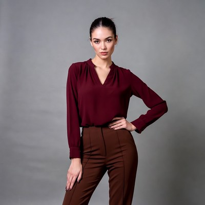 Woman in maroon blouse and pants