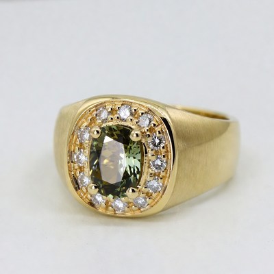Gold signet ring with green gemstone