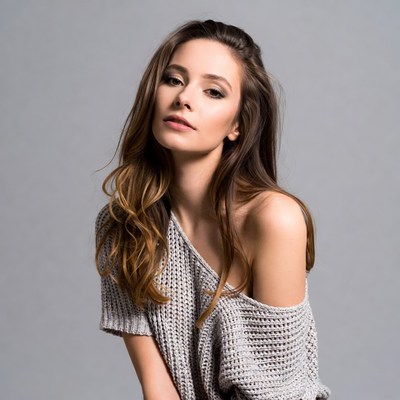 Woman in off-shoulder sweater