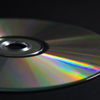 Shiny CD Disc on Black Background