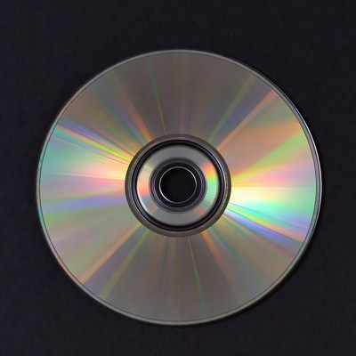 Shiny CD Disc on Black Background