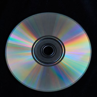 Shiny CD Disc on Black Background