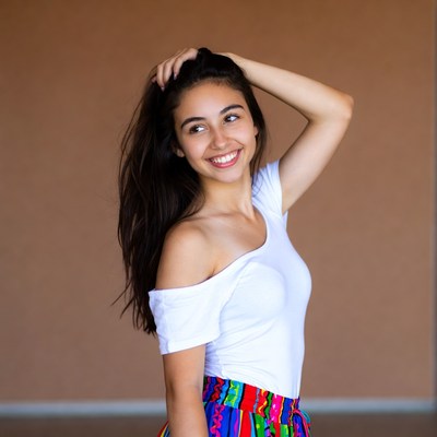 Smiling Latina woman hand in hair
