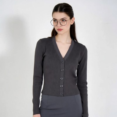 Woman in gray cardigan and skirt