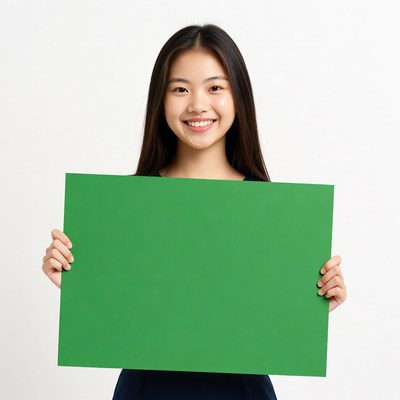 Asian girl holding green sign