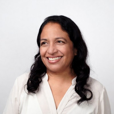 Smiling Asian woman in white blouse
