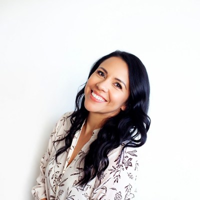 Smiling Latina woman in white blouse