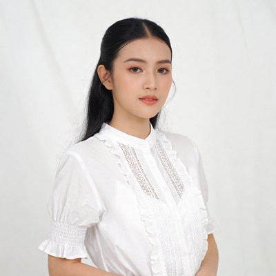 Asian woman in white lace blouse