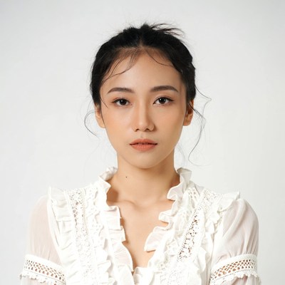 Asian woman in white lace blouse