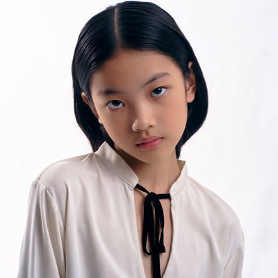 Asian girl in white shirt with bowtie