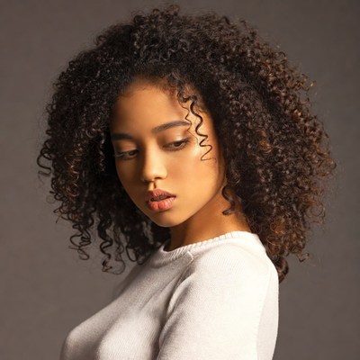 Woman with curly hair profile view