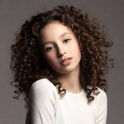 Girl with curly brown hair