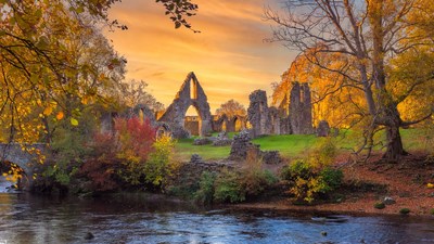 Autumn Ruins by River Sunset