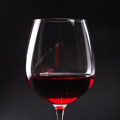 Red Wine Glass on Black Background