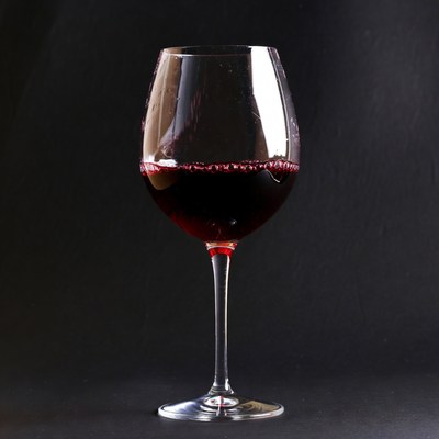 Red Wine Glass on Black Background
