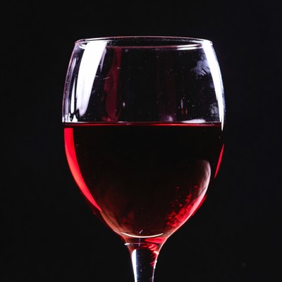 Red Wine Glass on Black Background