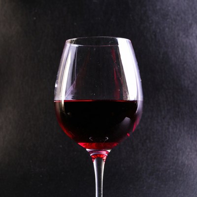 Red Wine Glass on Black Background