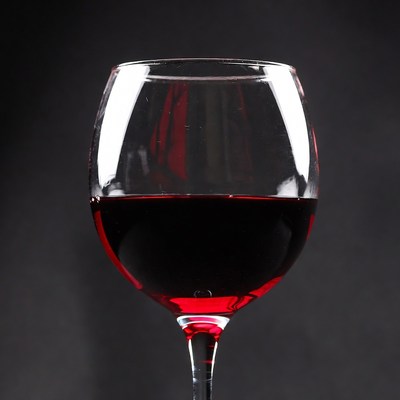 Red Wine Glass on Black Background