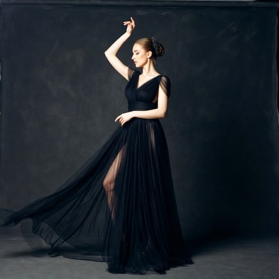 Woman dancing in flowing black gown