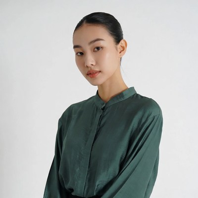 Asian woman in green shirt