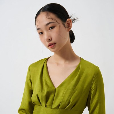 Asian woman in green dress