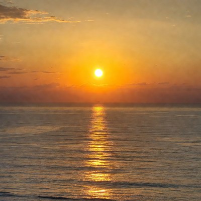 Sunset over calm ocean water