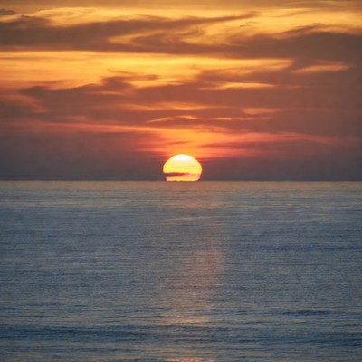Sunset over calm ocean