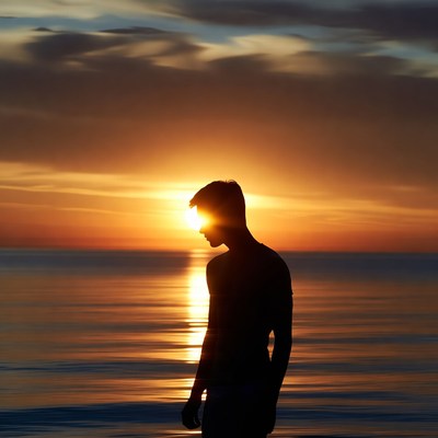 Silhouette of man at sunset beach