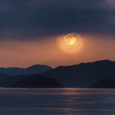 Full Moon Rising Over Mountains and Sea