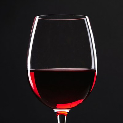 Red Wine Glass on Black Background