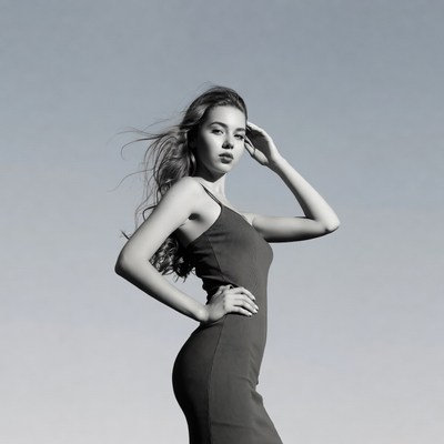 Young woman posing in black dress