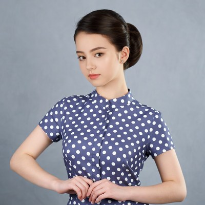 Asian woman in polka dot dress