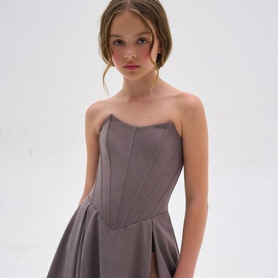Teen girl in strapless gray dress
