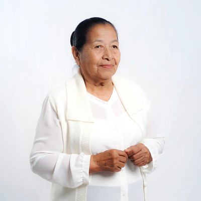 Elderly Asian woman in white outfit