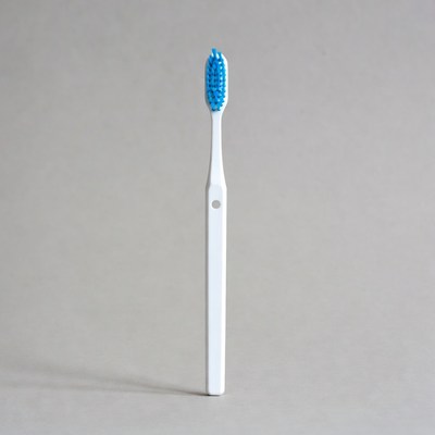 Blue toothbrush on gray background
