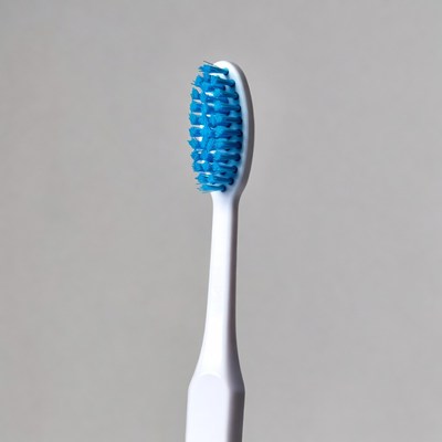 Blue toothbrush on white handle